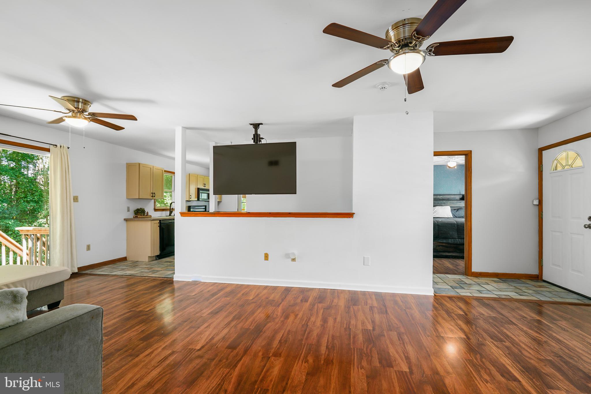 9 Kings Court Elkton, MD 21921 - Photo 12 of 33 a view of a kitchen with wooden floor and a ceiling fan