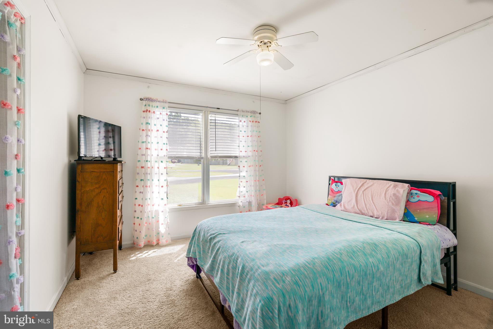 9 Kings Court Elkton, MD 21921 - Photo 17 of 33 a spacious bedroom with a bed and a chandelier