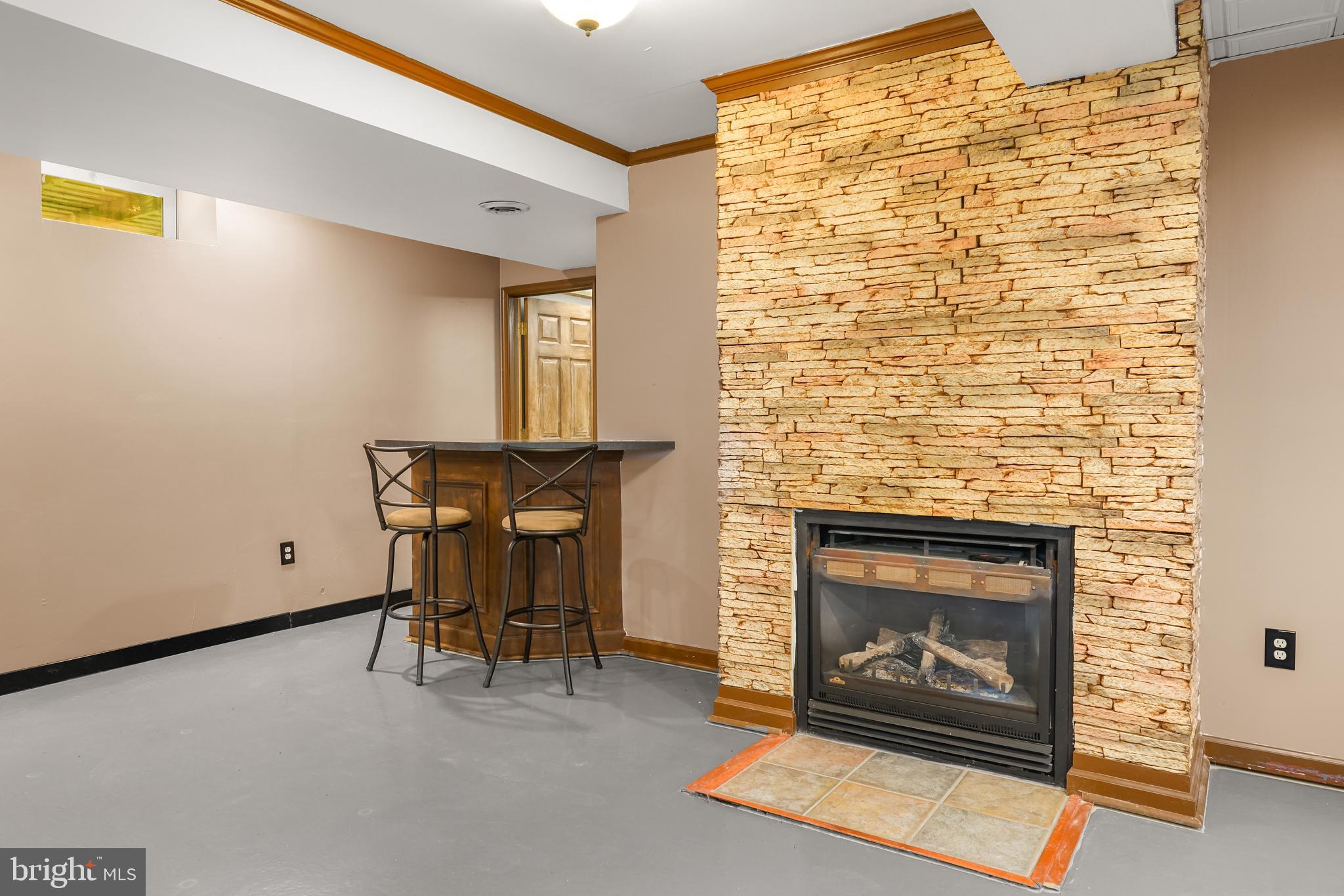 9 Kings Court Elkton, MD 21921 - Photo 20 of 33 a living room with furniture and a fireplace