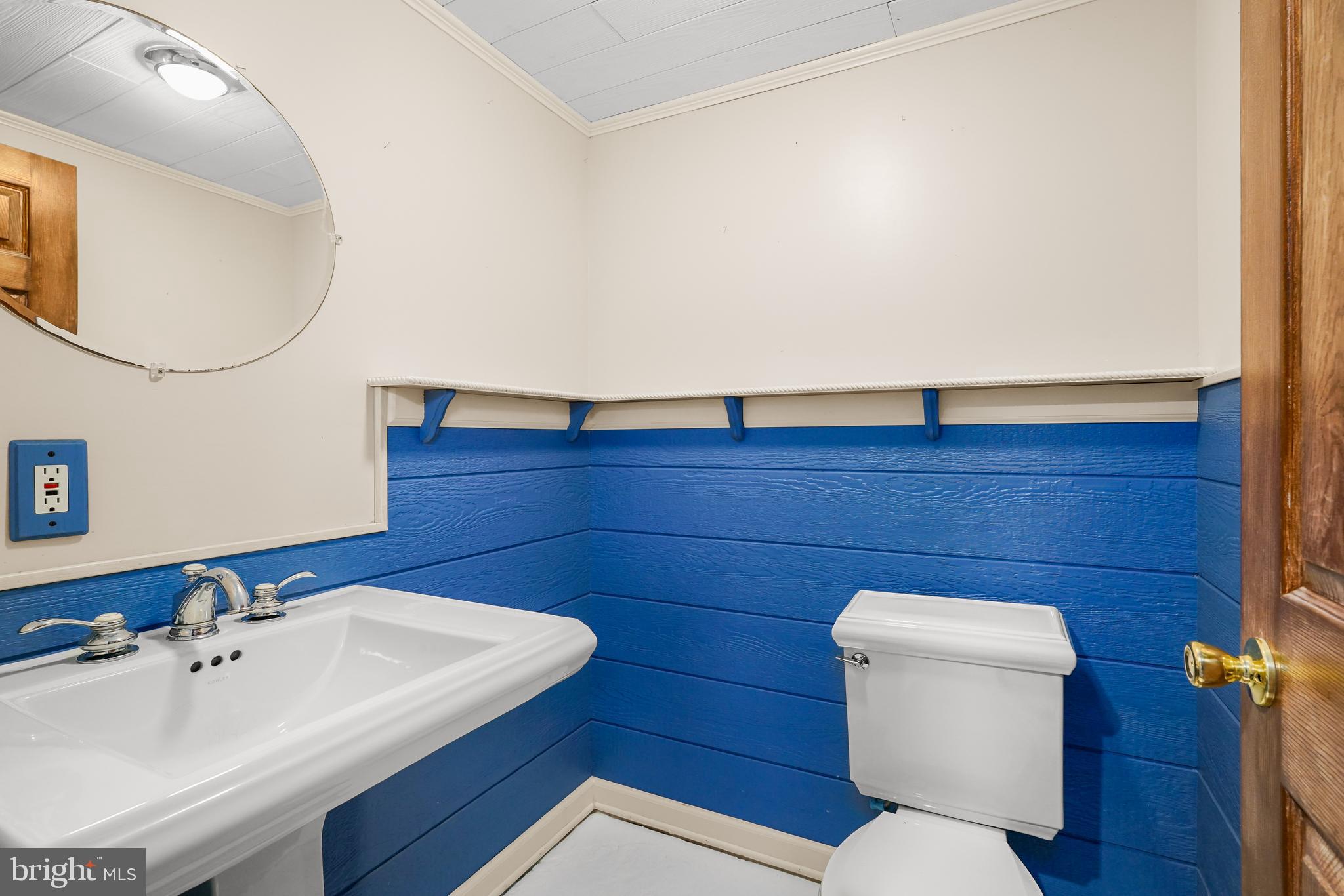 9 Kings Court Elkton, MD 21921 - Photo 24 of 33 a bathroom with a toilet a sink and mirror