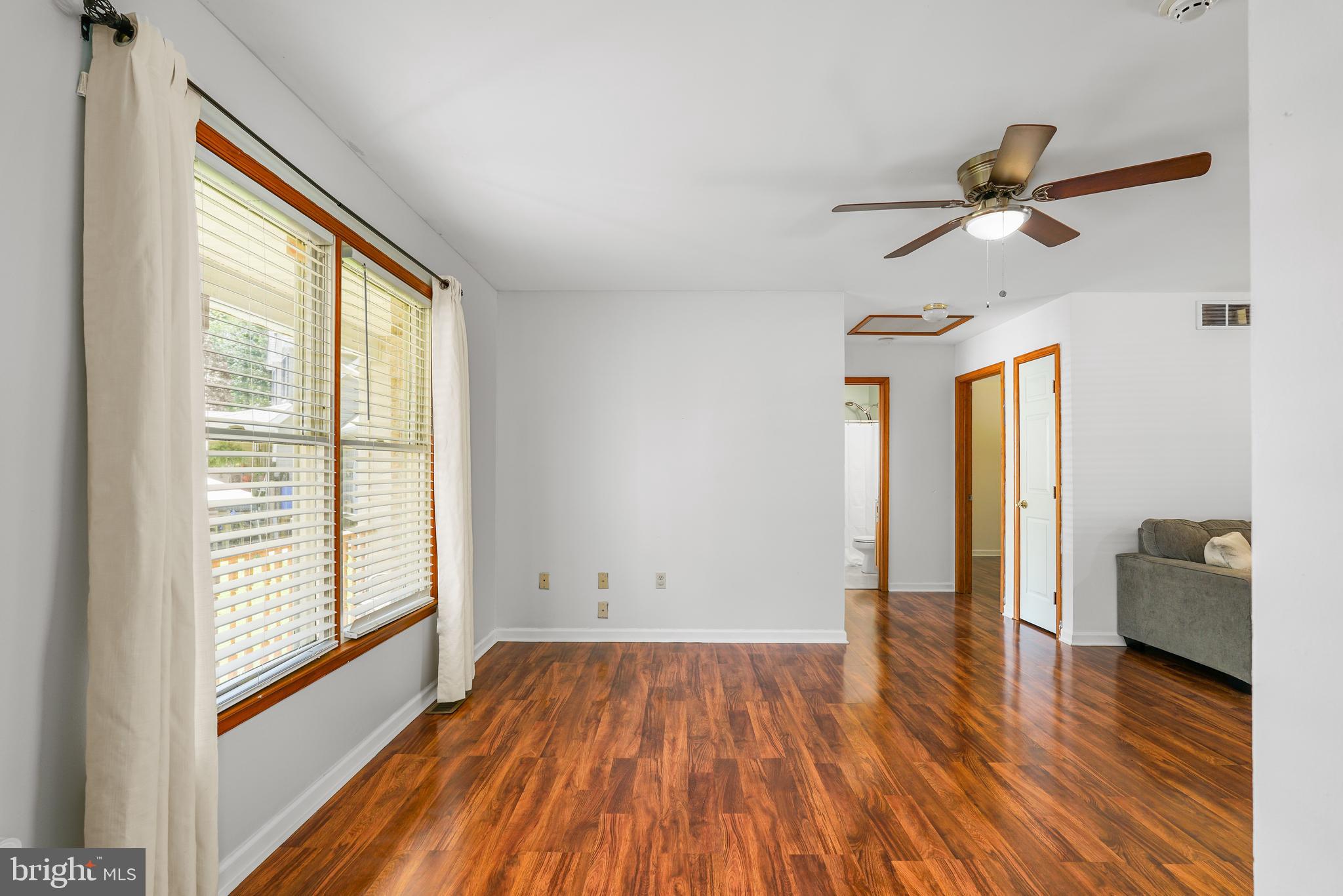 9 Kings Court Elkton, MD 21921 - Photo 5 of 33 a view of empty room with wooden floor and fan