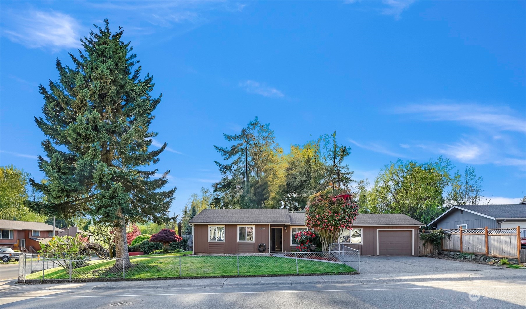 18216 22nd Drive Southeast Bothell, WA 98012 - Photo 1 of 40 a front view of a house with a yard and tree s