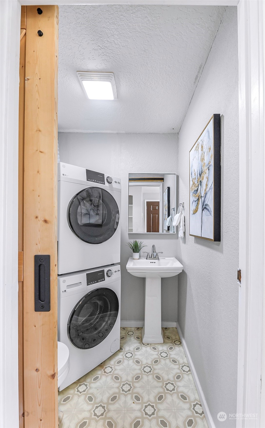 18216 22nd Drive Southeast Bothell, WA 98012 - Photo 11 of 40 a living room with a sink and a washer dryer