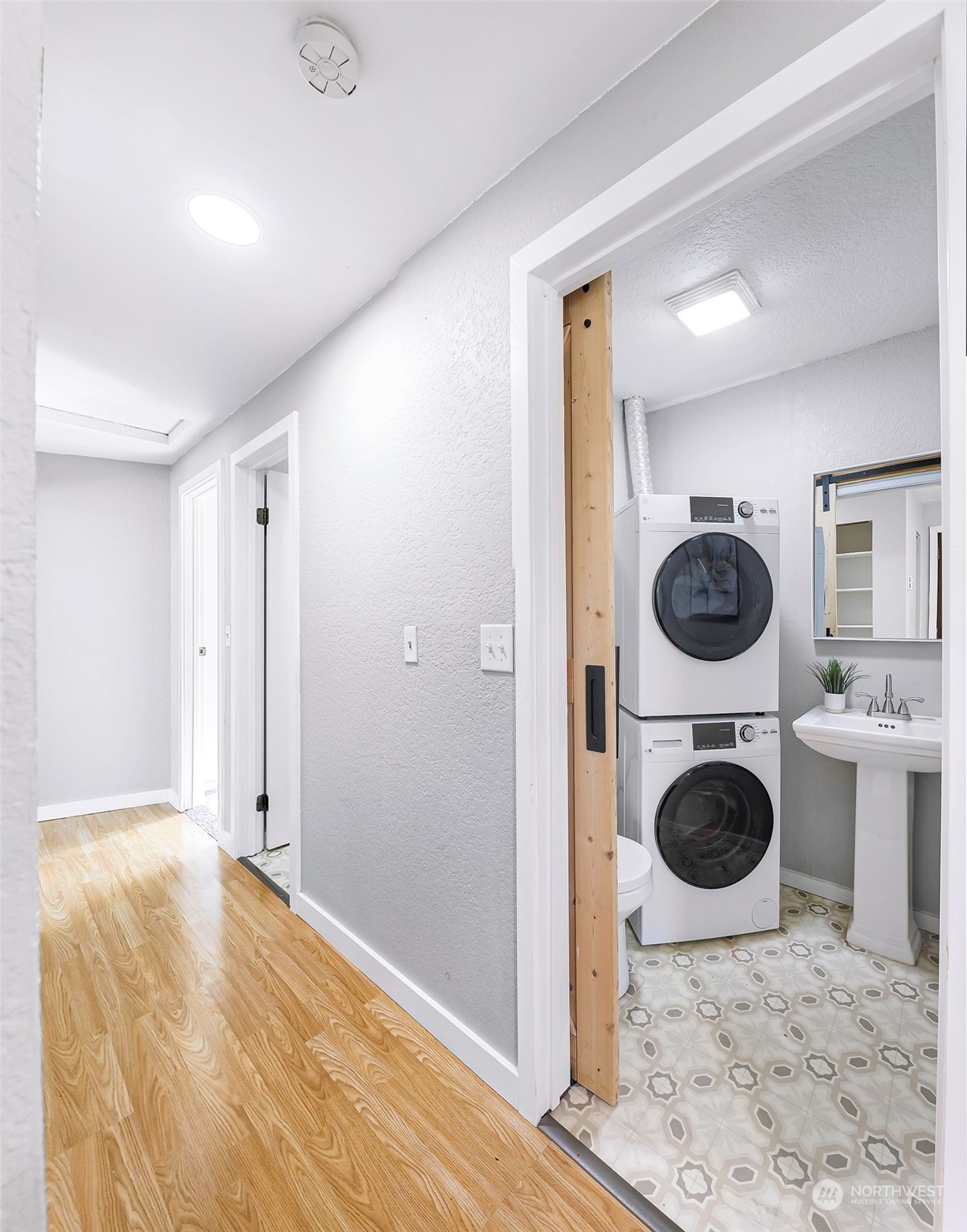 18216 22nd Drive Southeast Bothell, WA 98012 - Photo 12 of 40 a view of a hallway with washer and dryer