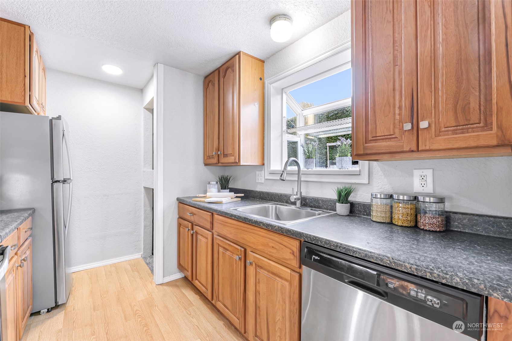 18216 22nd Drive Southeast Bothell, WA 98012 - Photo 19 of 40 a kitchen with a sink a refrigerator and window