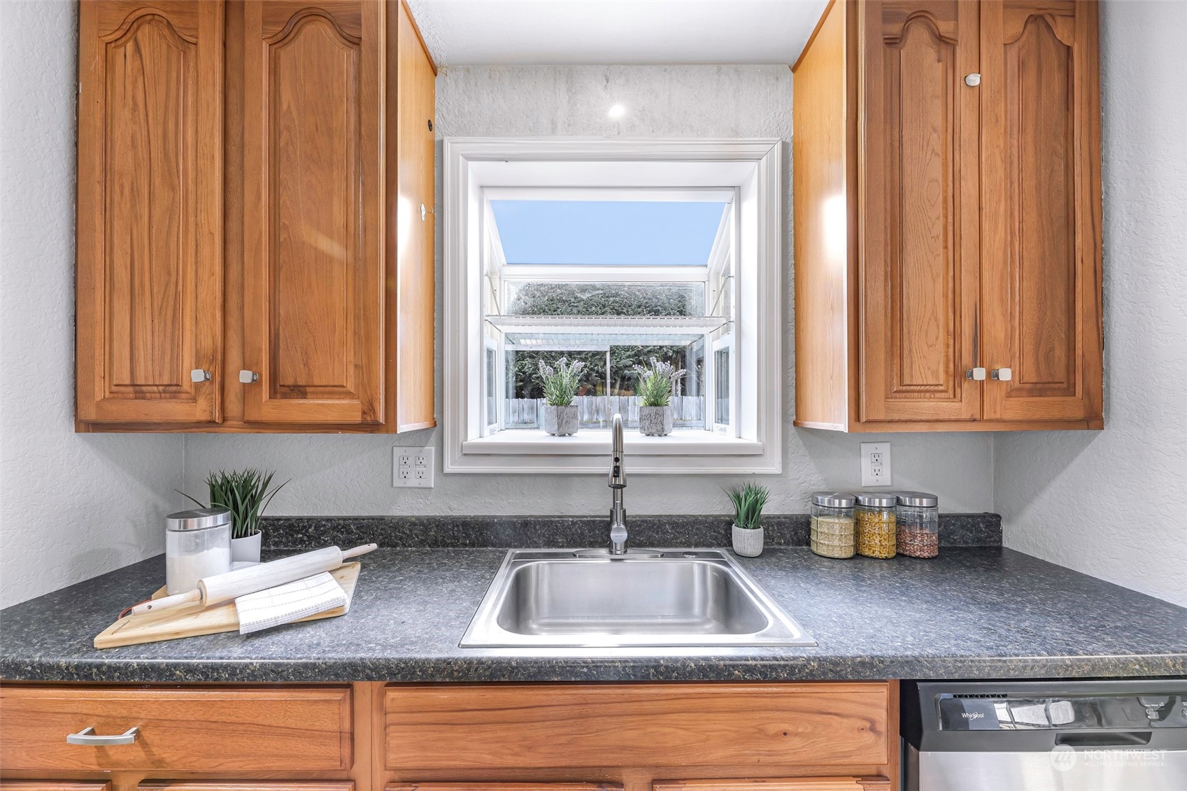 18216 22nd Drive Southeast Bothell, WA 98012 - Photo 20 of 40 a kitchen with sink a window and cabinets
