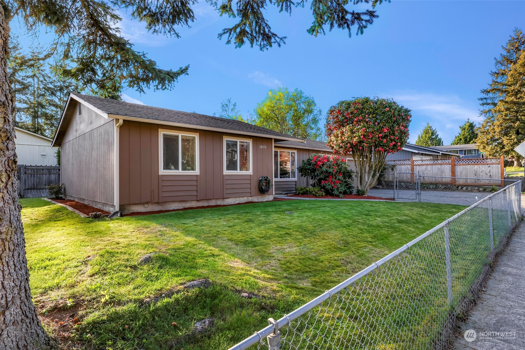 18216 22nd Drive Southeast Bothell, WA 98012 - Photo 2 of 40 a view of a backyard with table and chairs and potted plants
