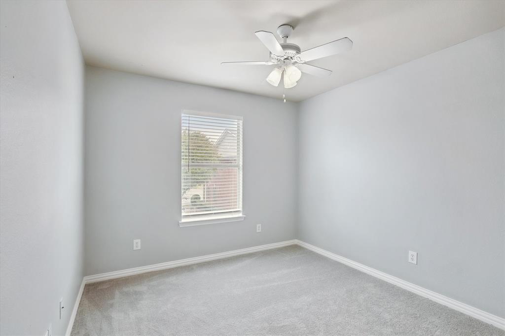 2202 Sandshell Street Bedford, TX 76021 - Photo 30 of 40 Empty room with carpet and ceiling fan