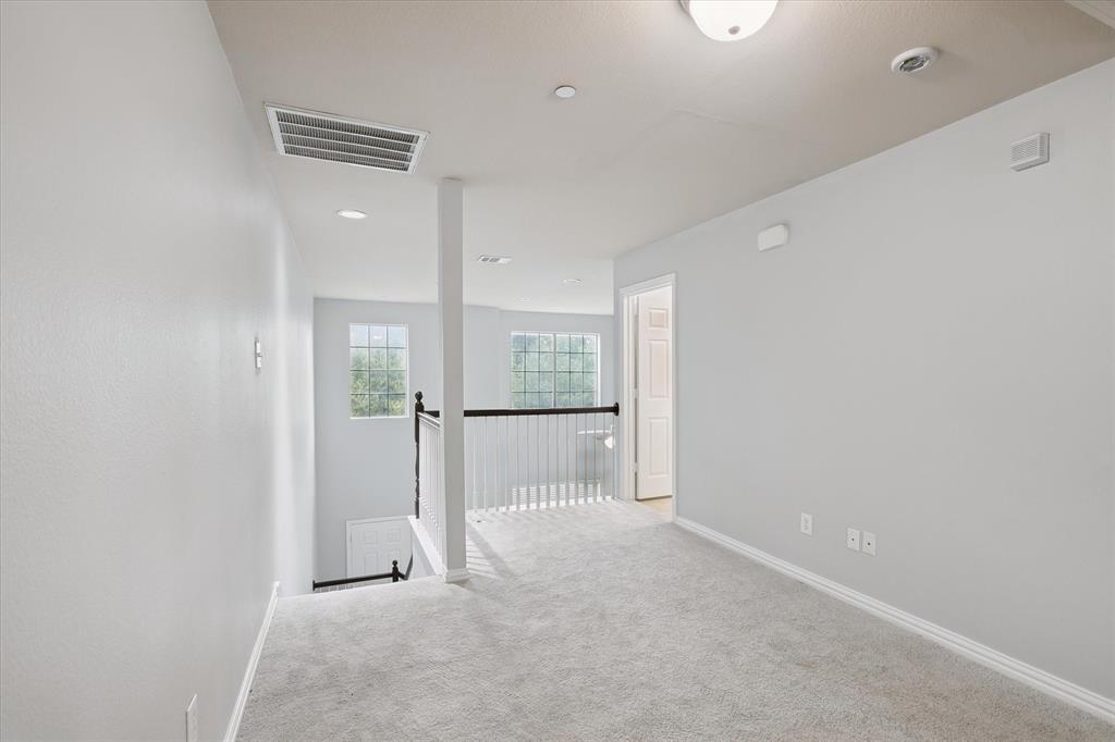 2202 Sandshell Street Bedford, TX 76021 - Photo 35 of 40 Carpeted empty room featuring baseboards and recessed lighting