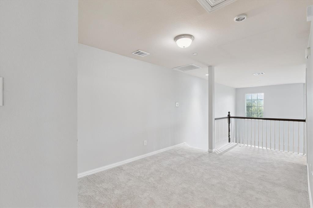 2202 Sandshell Street Bedford, TX 76021 - Photo 36 of 40 Unfurnished room with light carpet and baseboards