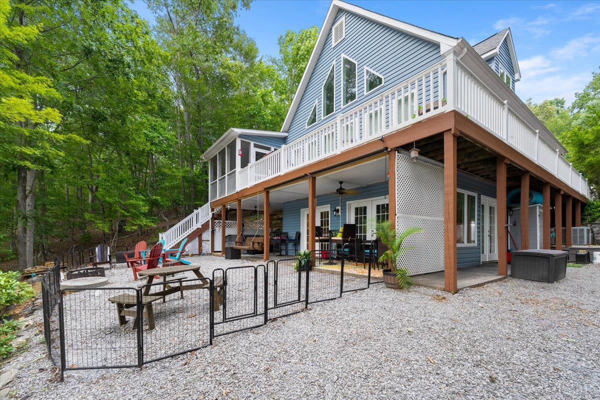 1765 Heron Pointe Drive Gretna, VA 24557 - Photo 2 of 64 a view of a house with backyard and sitting area