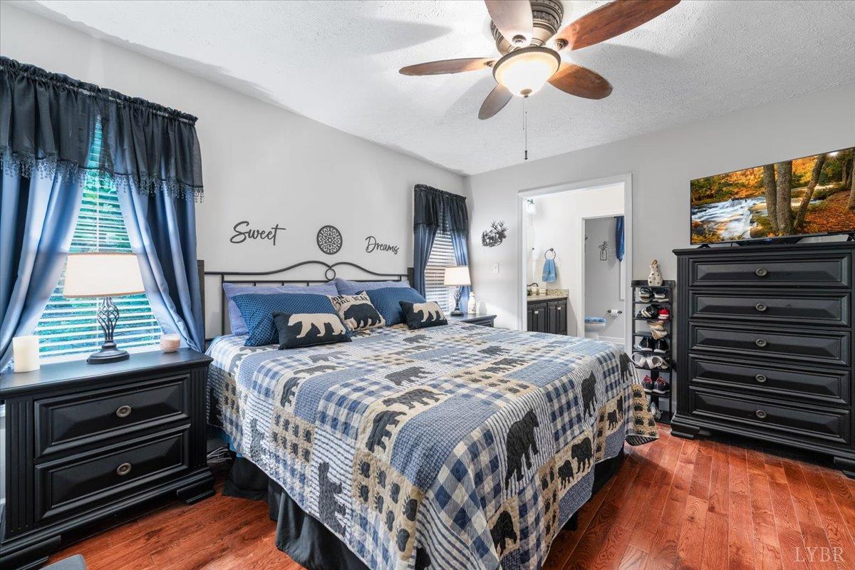 1765 Heron Pointe Drive Gretna, VA 24557 - Photo 22 of 64 a bedroom with a bed and a flat tv screen