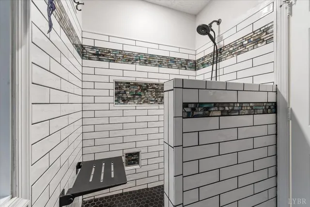 a bathroom with a bathtub and shower