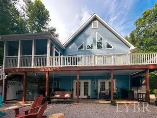 a view of a house with a porch and furniture
