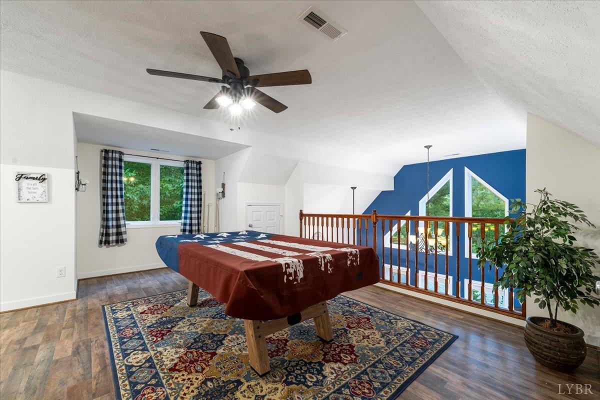 1765 Heron Pointe Drive Gretna, VA 24557 - Photo 31 of 64 a dining room with wooden floor and windows