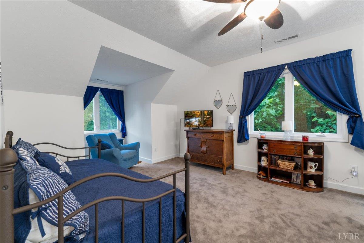 1765 Heron Pointe Drive Gretna, VA 24557 - Photo 33 of 64 a living room with furniture and a large window