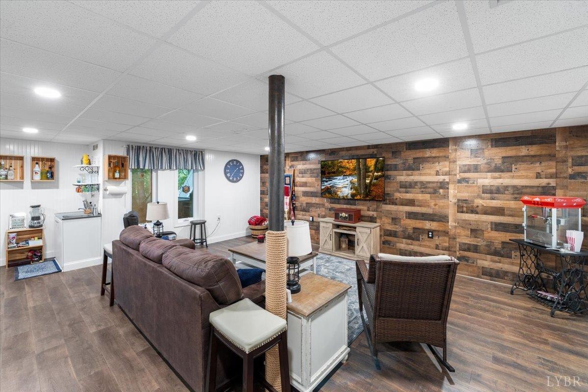 1765 Heron Pointe Drive Gretna, VA 24557 - Photo 36 of 64 a living room with furniture and a wooden floor