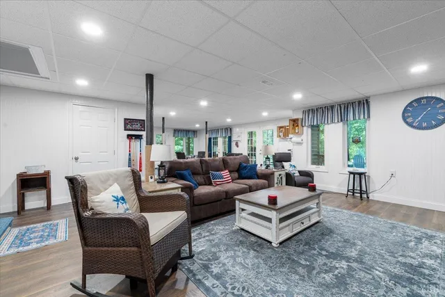 a view of a workspace with furniture and wooden floor