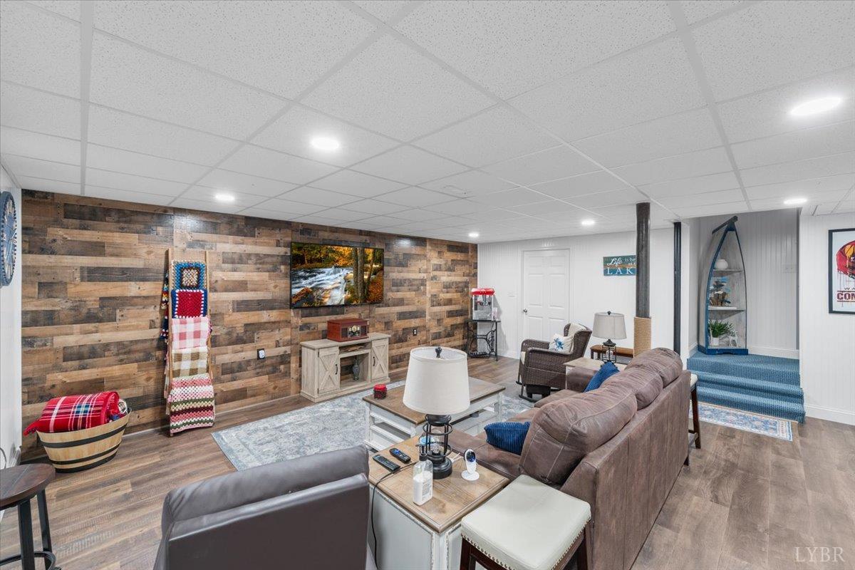 1765 Heron Pointe Drive Gretna, VA 24557 - Photo 39 of 64 a living room with furniture and a wooden floor