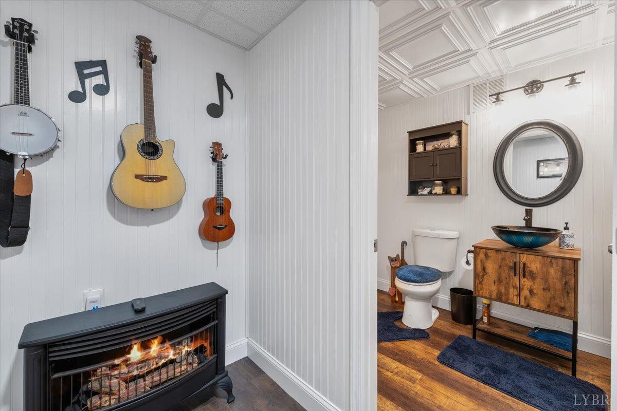 1765 Heron Pointe Drive Gretna, VA 24557 - Photo 46 of 64 a bathroom with a toilet a sink and a mirror