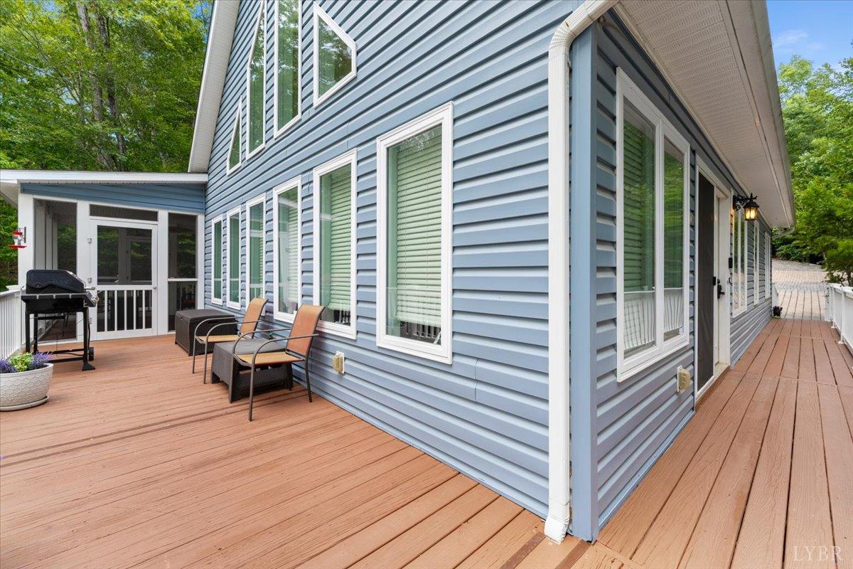 1765 Heron Pointe Drive Gretna, VA 24557 - Photo 7 of 64 a balcony with wooden floor and furniture