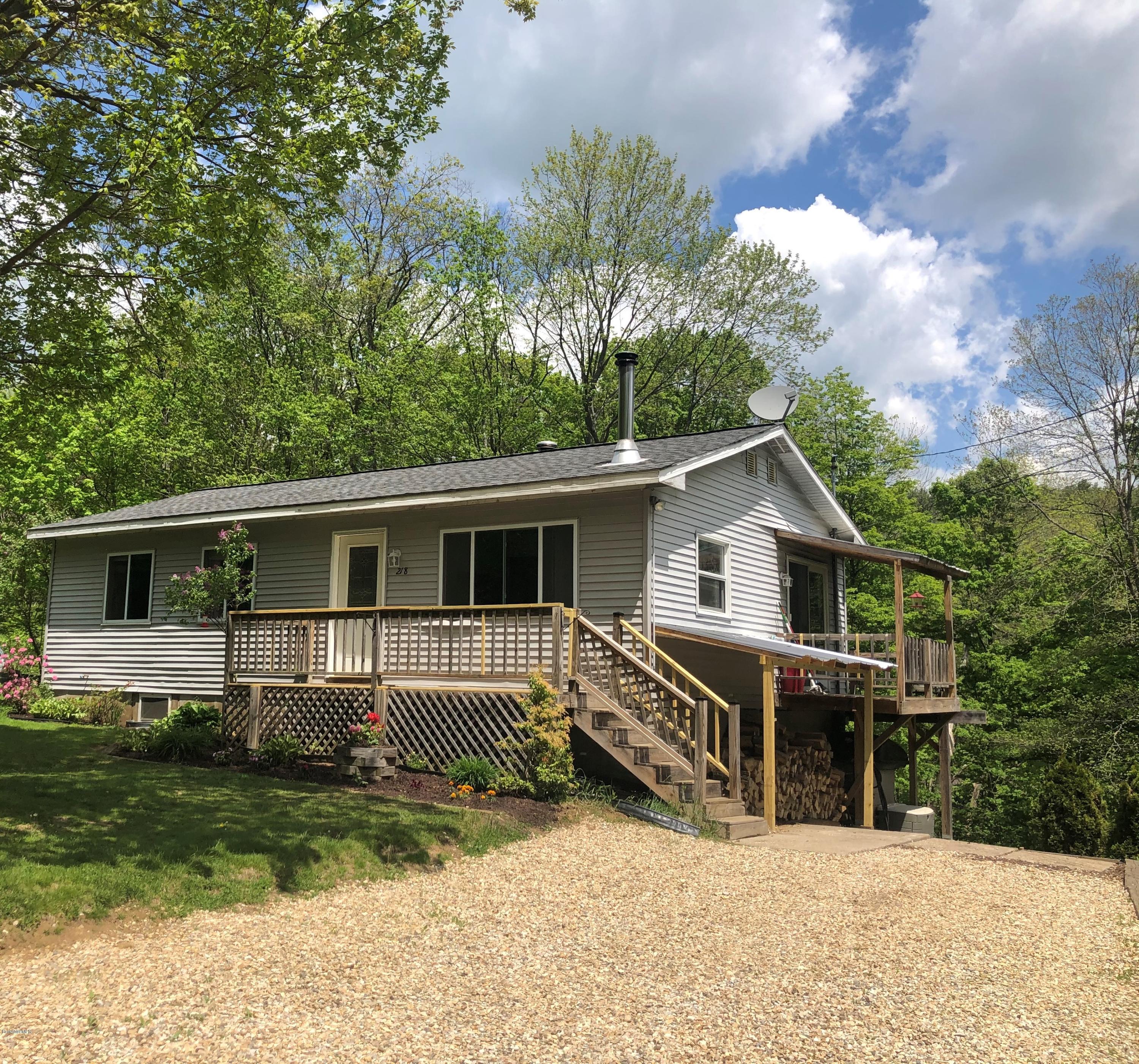 218 Upper Valley Road Washington, MA 01223 - Photo 1 of 33 a view of a house with a backyard