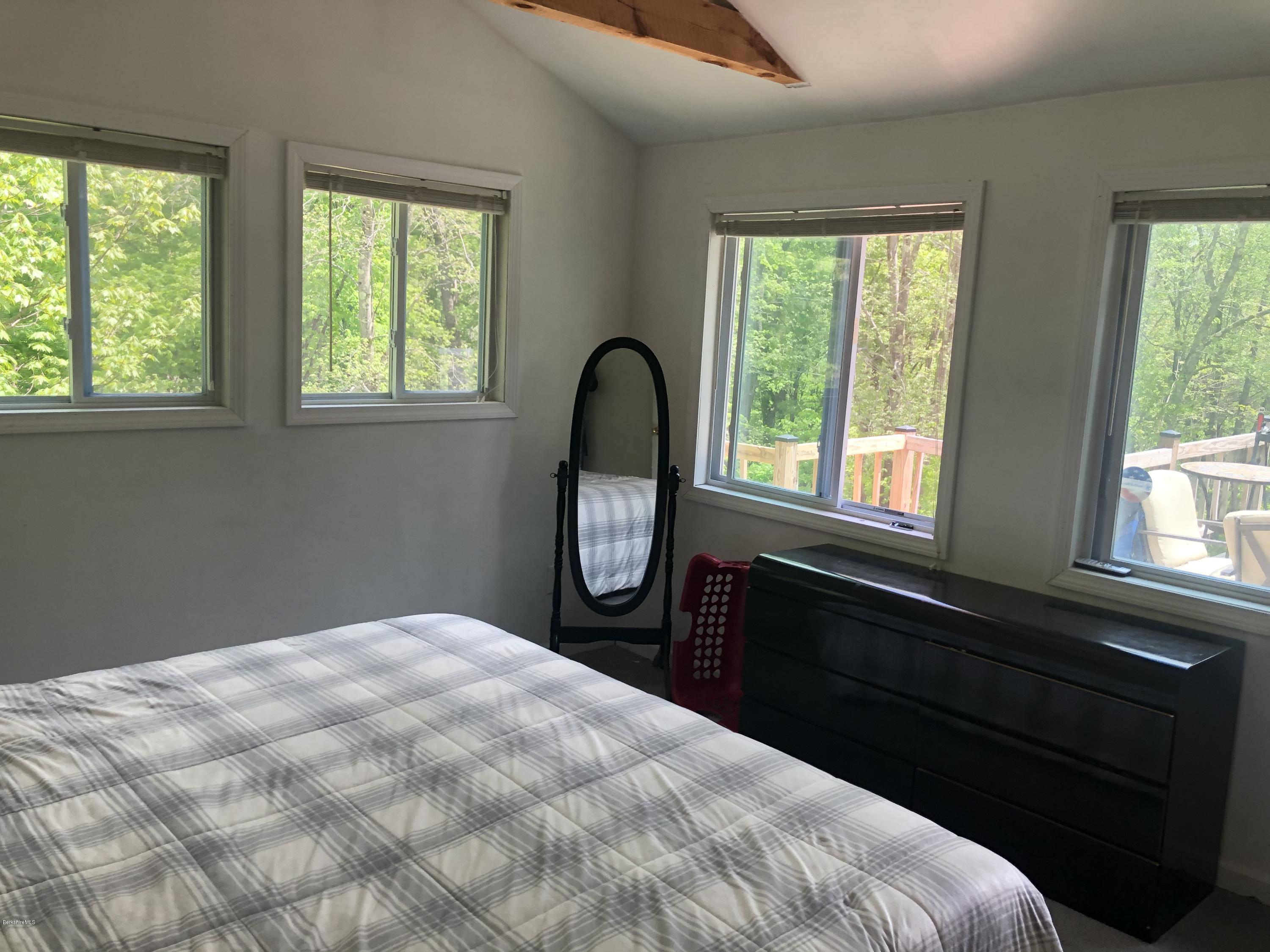 218 Upper Valley Road Washington, MA 01223 - Photo 13 of 33 a bedroom with a bed and a large window