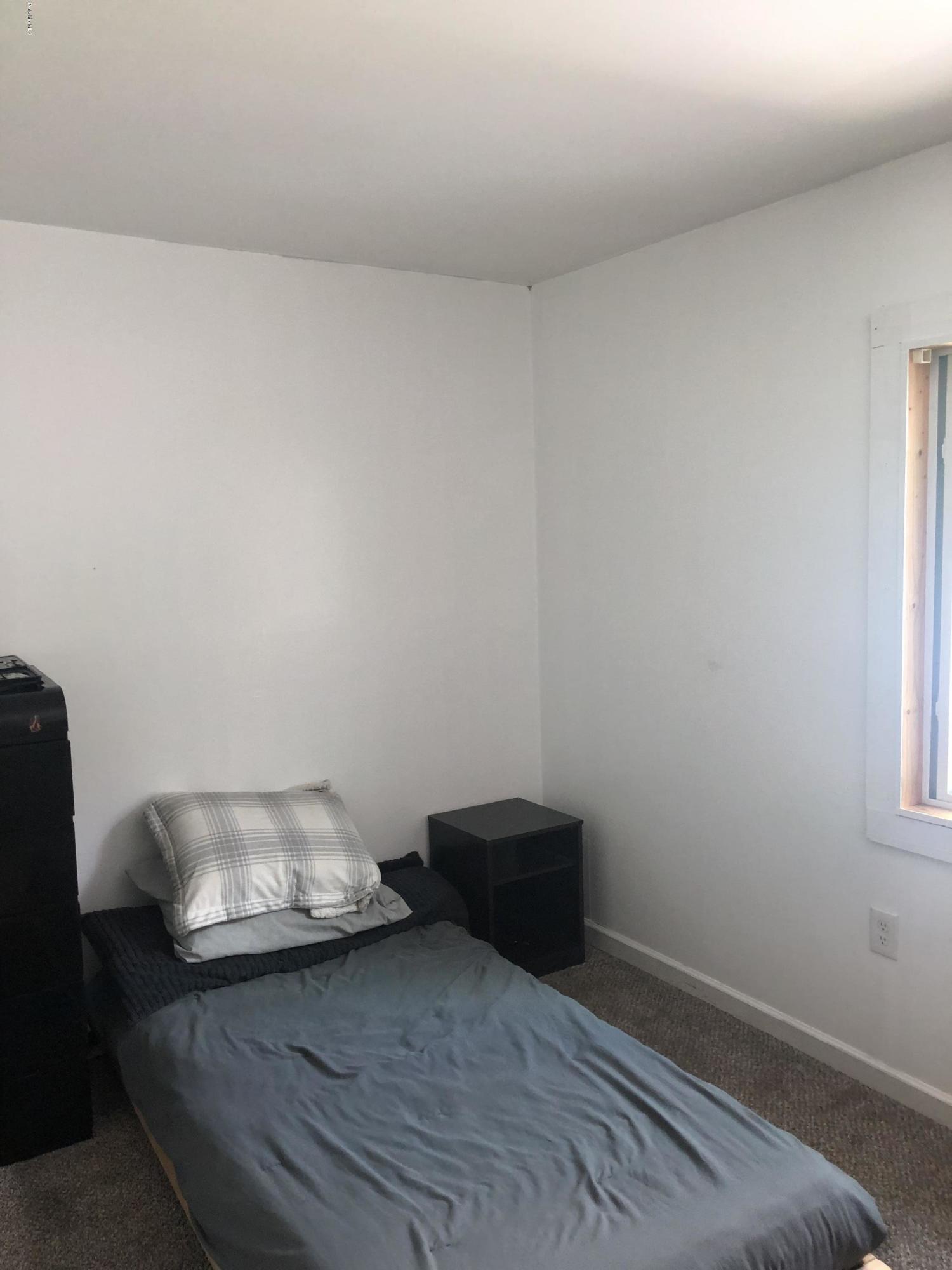218 Upper Valley Road Washington, MA 01223 - Photo 19 of 33 a room with a bed and a chair