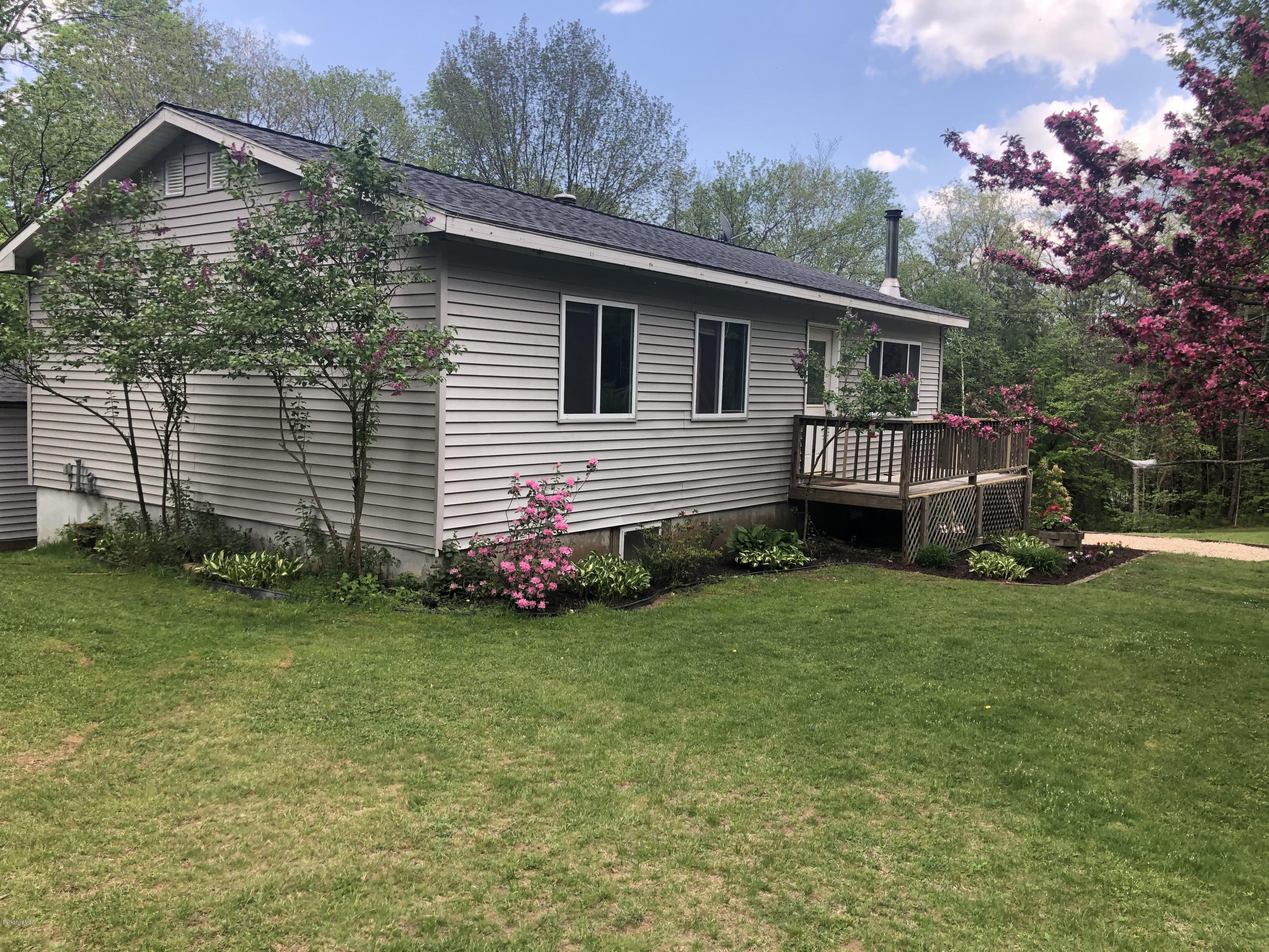 218 Upper Valley Road Washington, MA 01223 - Photo 29 of 33 a front view of a house with a garden