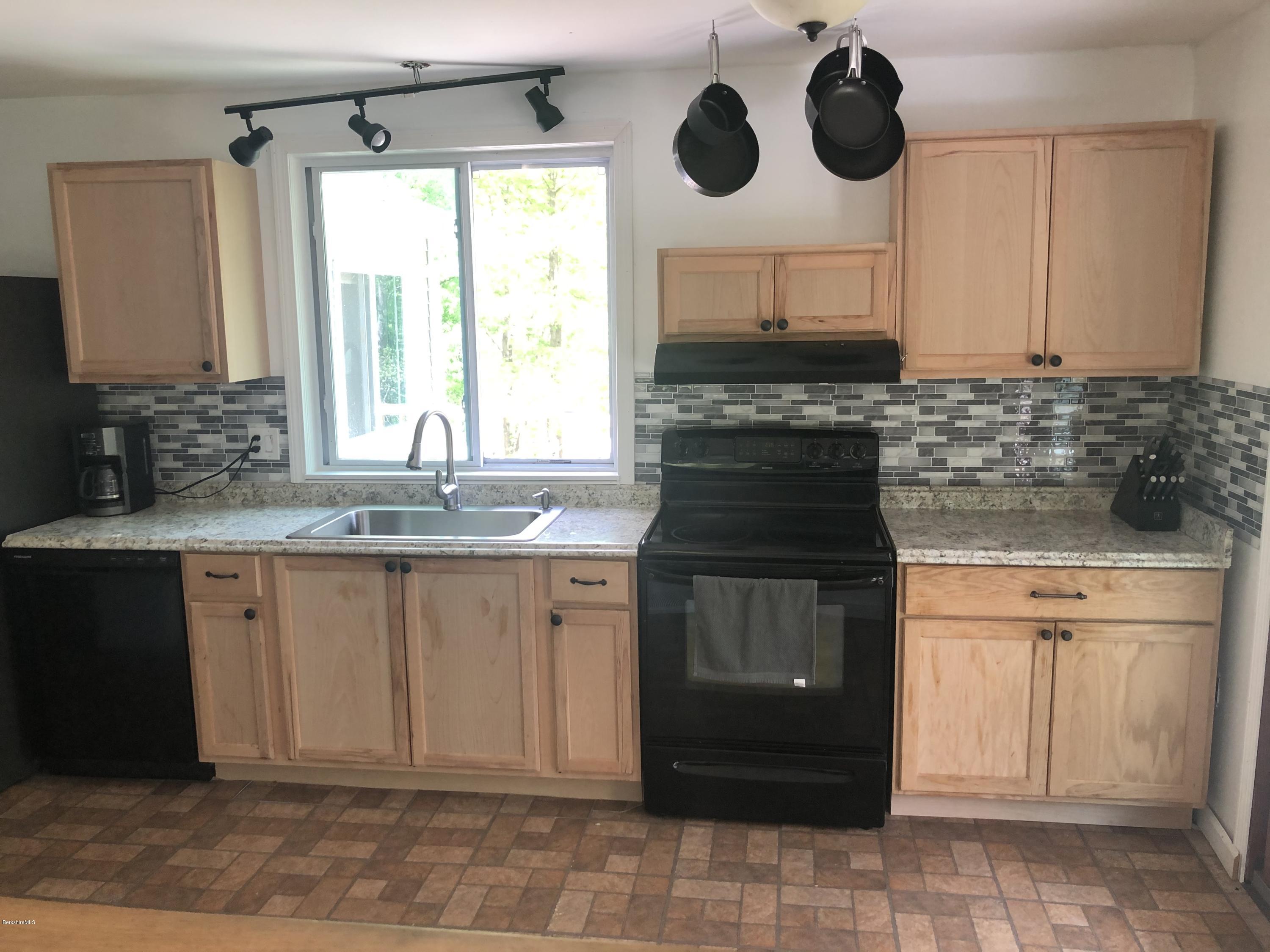 218 Upper Valley Road Washington, MA 01223 - Photo 7 of 33 a kitchen with cabinets appliances and a sink