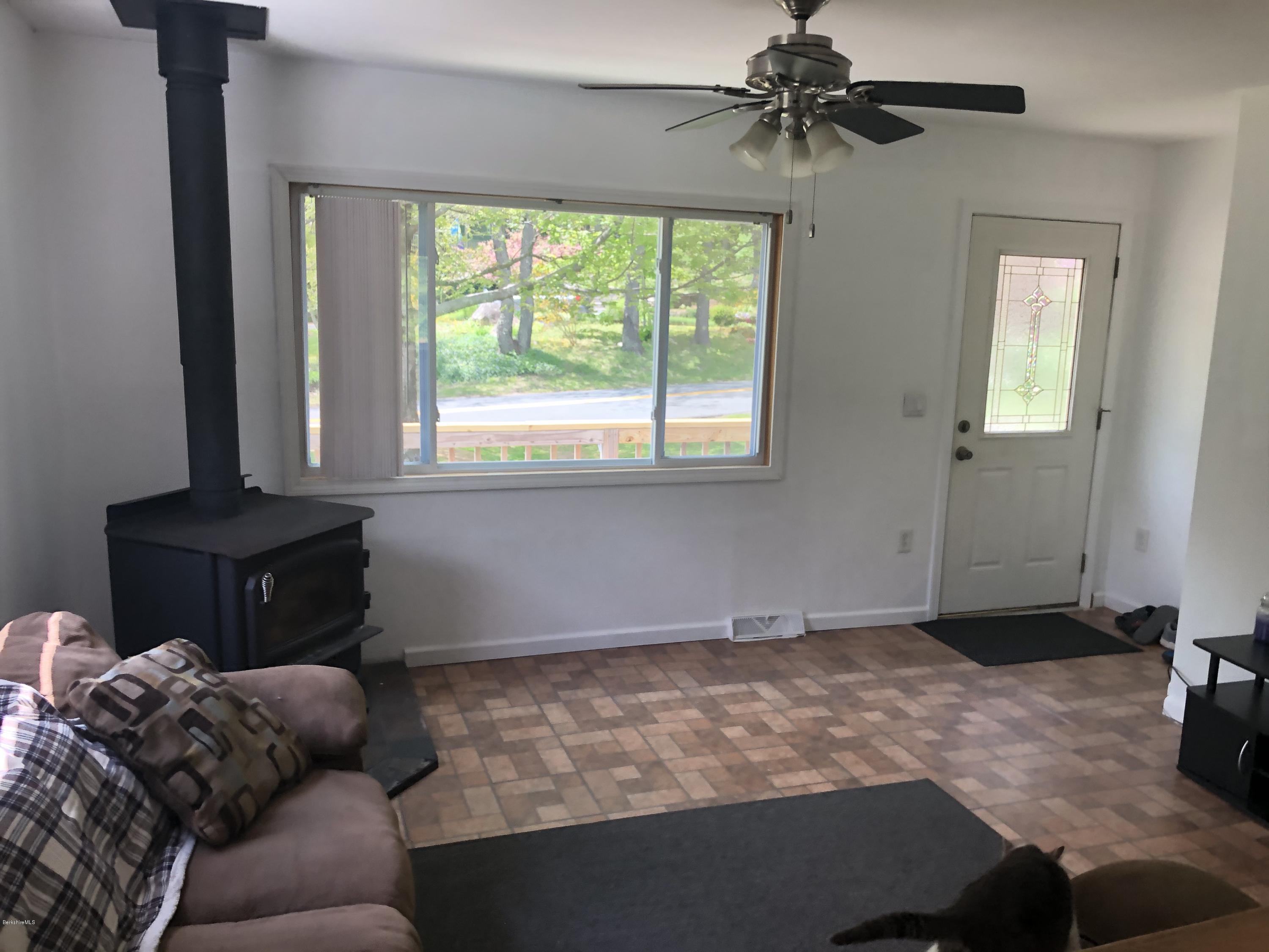 218 Upper Valley Road Washington, MA 01223 - Photo 10 of 33 a living room with furniture and a window