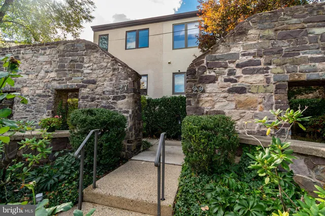 a view of a room with lots of furniture and wooden floor
