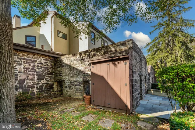 a balcony with table and chairs
