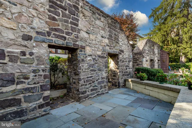 a view of a patio with a table and chairs