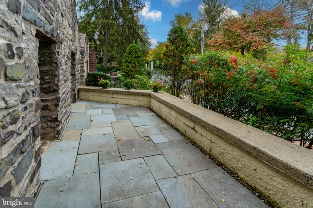 a kitchen with stainless steel appliances granite countertop a refrigerator a sink and a stove