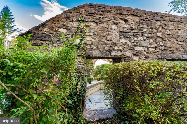 a kitchen with stainless steel appliances granite countertop a sink and a refrigerator