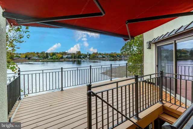 a view of a room with wooden floor and a window