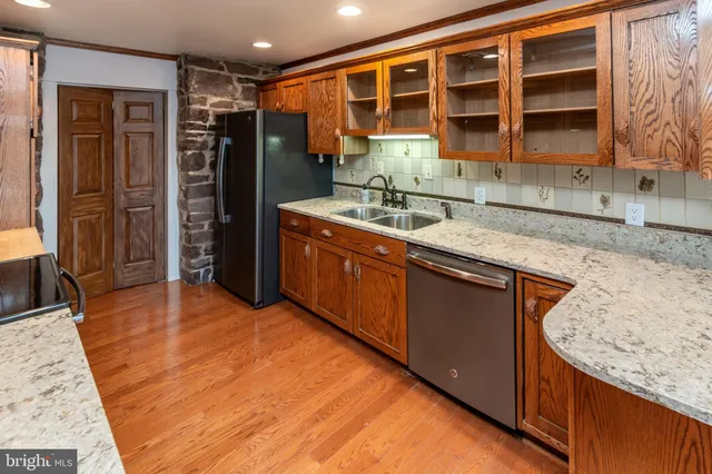 a view of a hallway with a wooden door