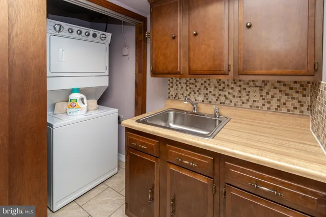 a front view of a house with plants