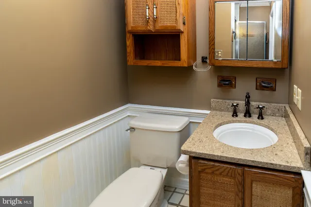 an aerial view of residential houses with outdoor space and river