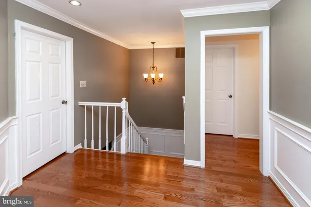 an aerial view of residential houses with outdoor space and street view