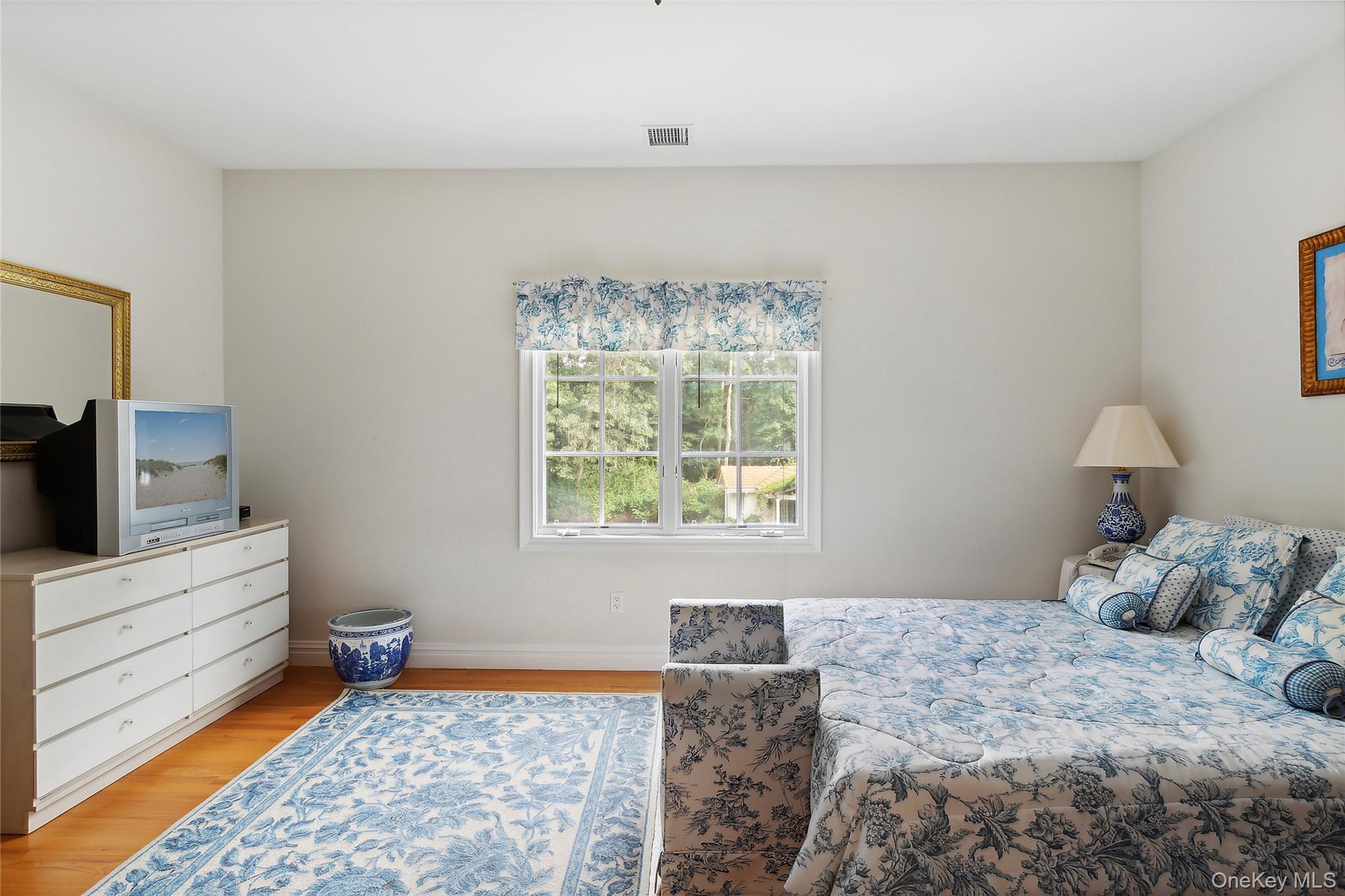 1 Terrys Trail East Hampton, NY 11937 - Photo 12 of 25 Bedroom featuring light wood-style flooring and baseboards