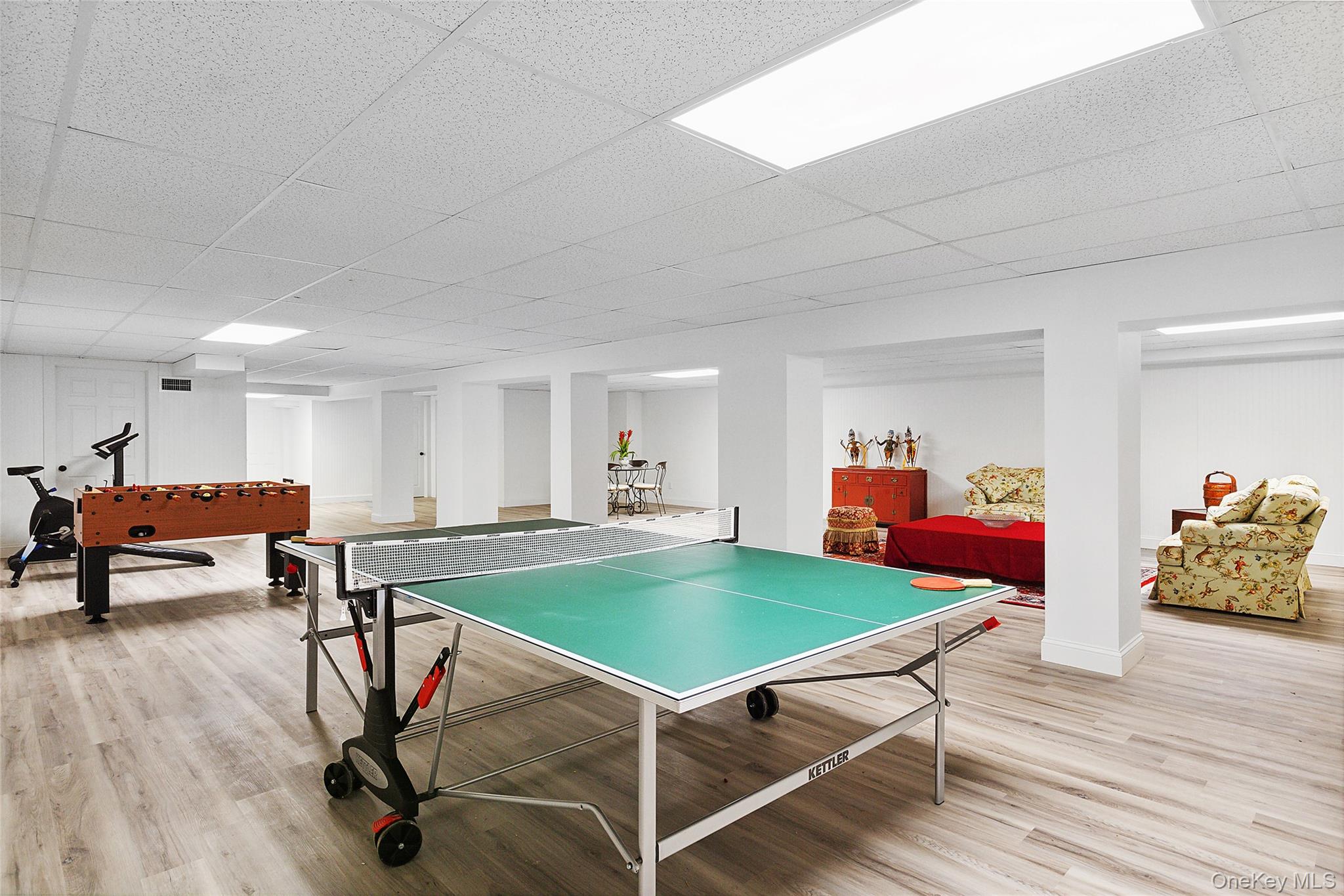 1 Terrys Trail East Hampton, NY 11937 - Photo 15 of 25 Recreation room featuring a paneled ceiling and light wood-type flooring