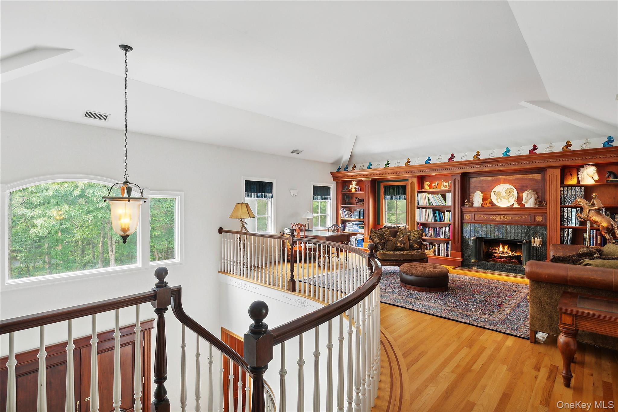 1 Terrys Trail East Hampton, NY 11937 - Photo 16 of 25 Hall with wood finished floors, an upstairs landing, and vaulted ceiling