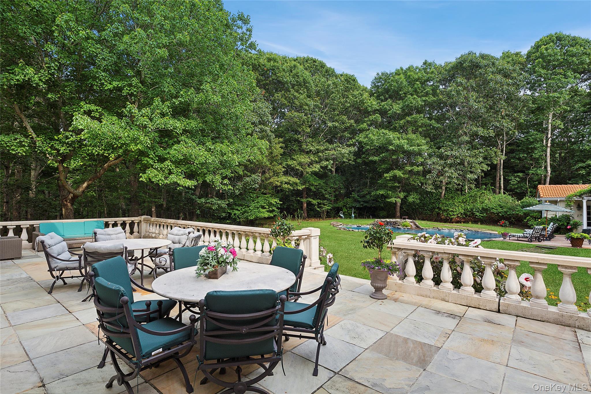 1 Terrys Trail East Hampton, NY 11937 - Photo 4 of 25 View of patio with outdoor dining space, a swimming pool, and an outdoor living space