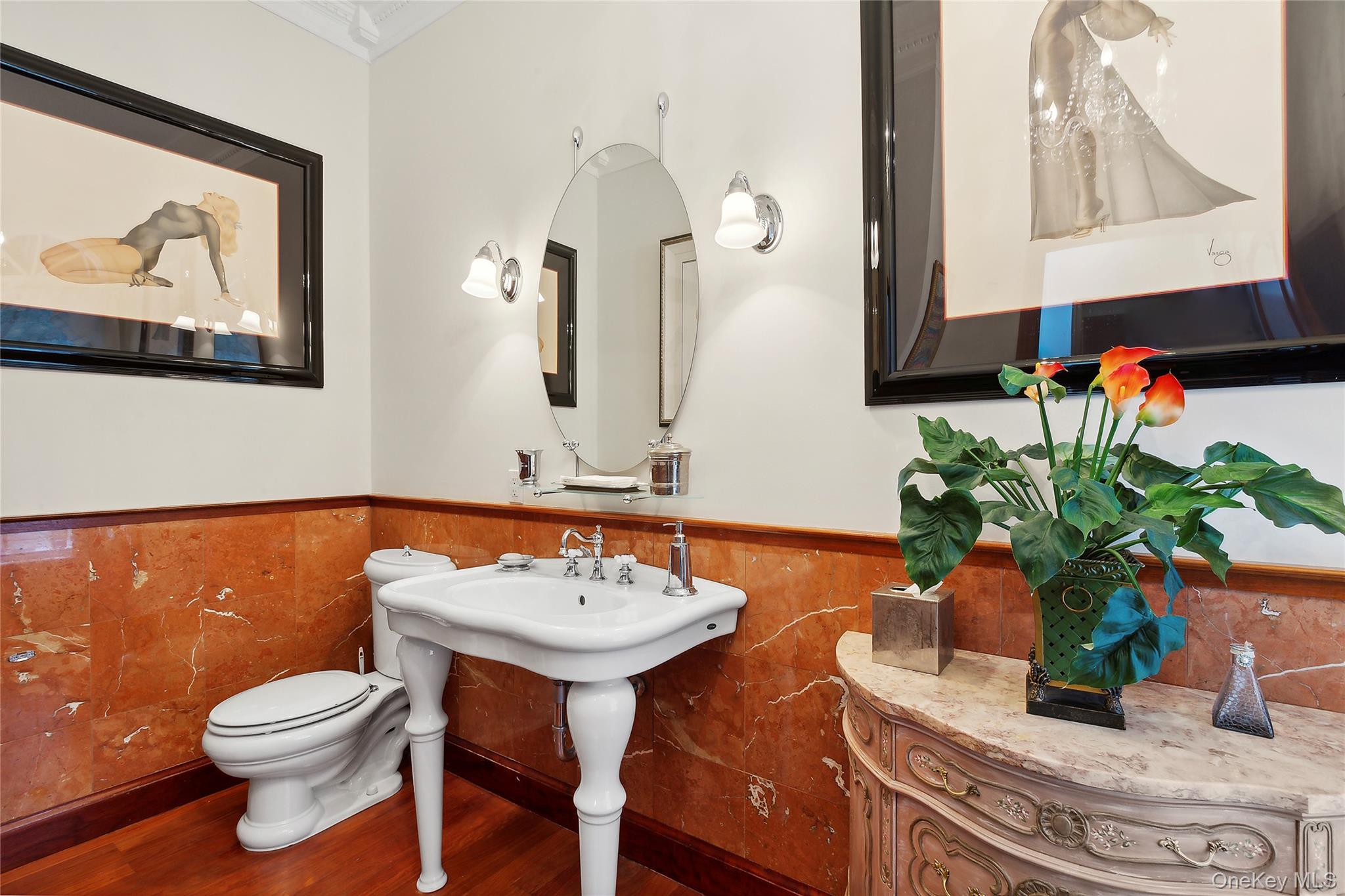 1 Terrys Trail East Hampton, NY 11937 - Photo 10 of 25 Half bathroom with wainscoting and wood finished floors