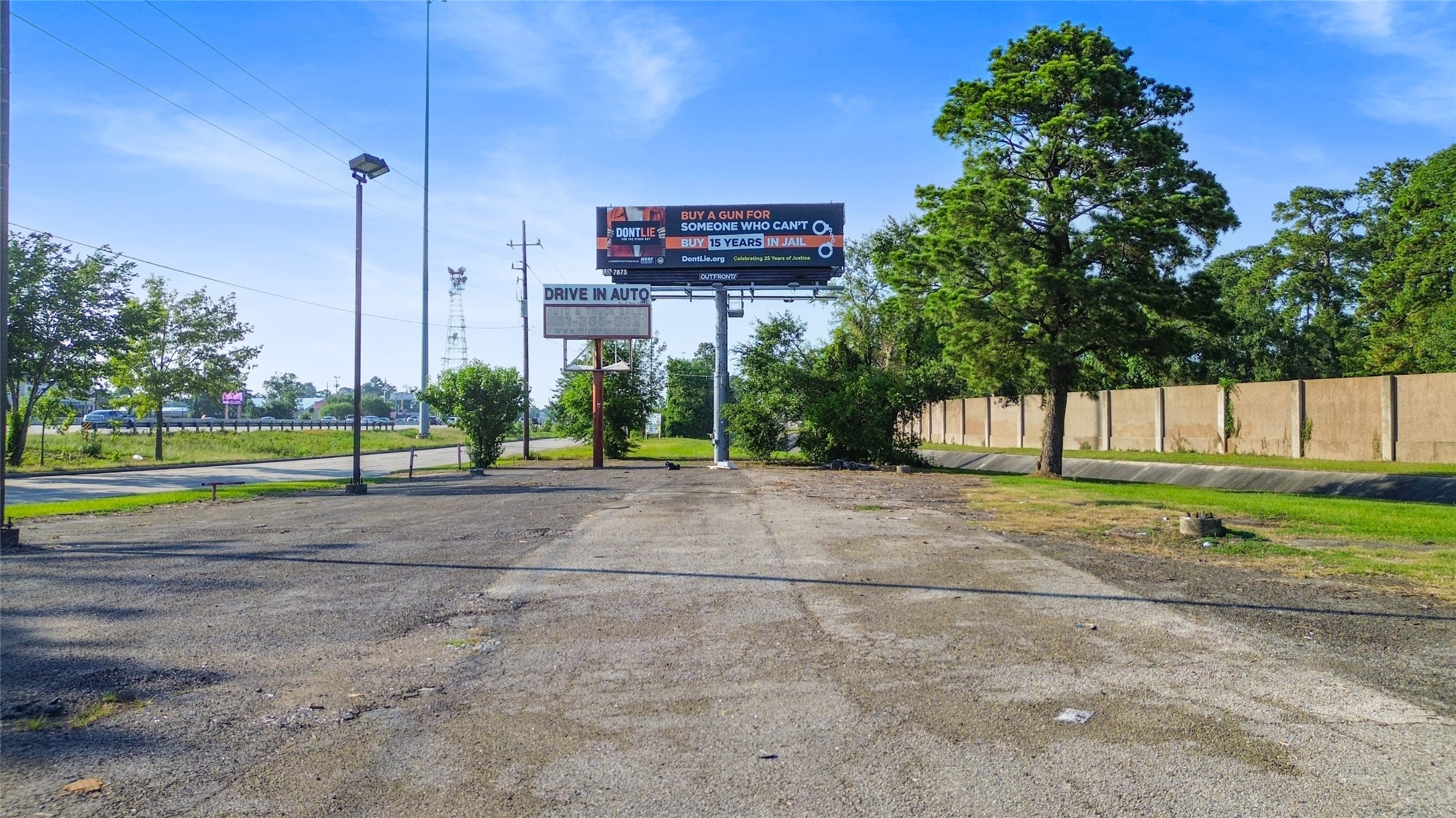 19002 Interstate 45 Spring, TX 77373 - Photo 3 of 10 a view of a house with a yard and a road