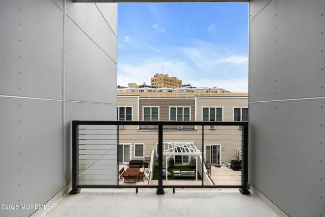 a view of a balcony with chairs