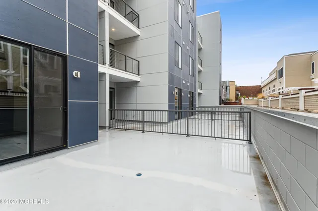 a view of balcony with a floor to ceiling window