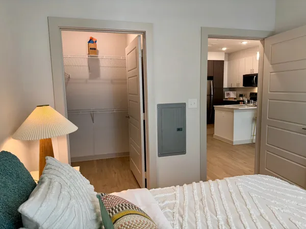 a bedroom with a bed and a chair